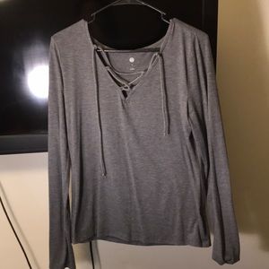 crossed grey shirt